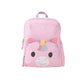 Skip Hop Besties Squad unicorn backpack for kids in pastel pink, front view showing unicorn face front pocket with golden horn, rainbow mane and pink ears