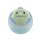Top view of the Skip Hop dino toddler snack cup showing the smiling green dinosaur face printed on the lid